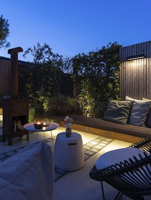 in-lite Evo Flex installed under bench, illuminating patio.