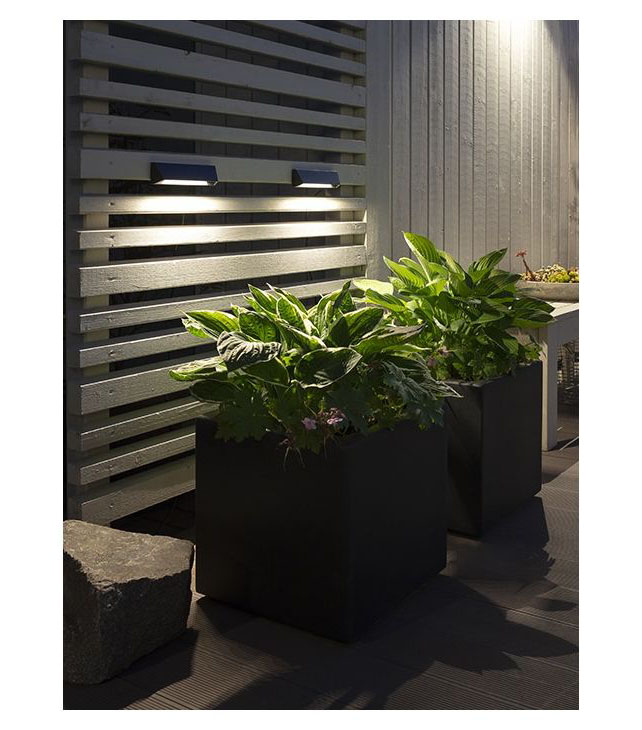 In-Lite Wedge Slim Dark on fense wall, illumintate