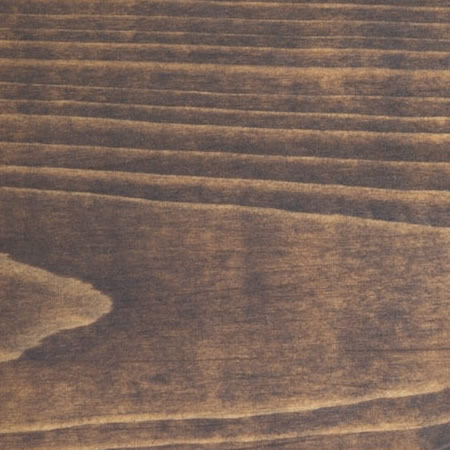 pecan finish cutek sample on brown pressure treated lumber