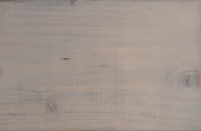 smokey grey finish cutek sample on brown pressure treated lumber